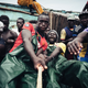 Local fishermen in Senegal cast their nets. Other than a motor and GPS, their boat lacks any modern equipment.